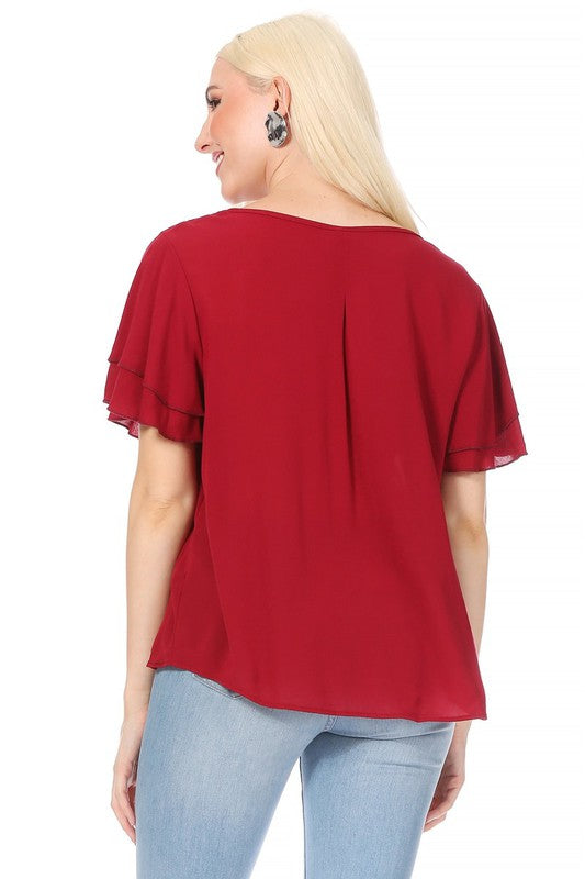 Short flutter sleeve round neck keyhole blouse.