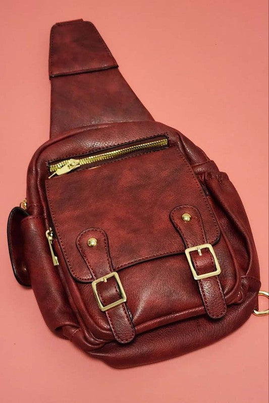 TWO STRAP DETAIL FRONT VEGAN LEATHER SLING BAGS